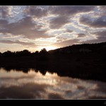 Sunset above water dam