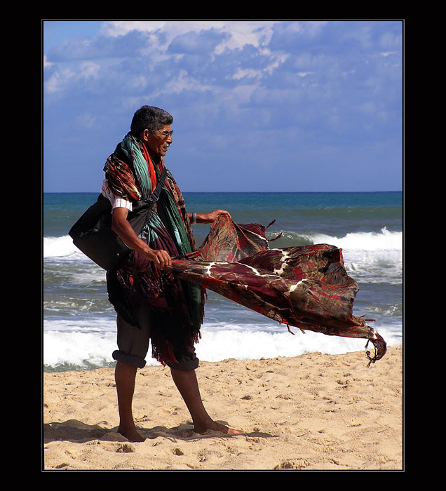 Prodavač šátků...