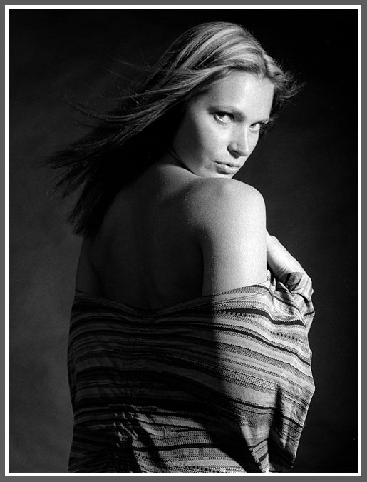 looking back over her shoulder