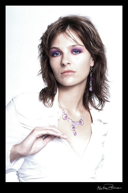 white girl with violet necklace
