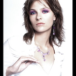 white girl with violet necklace