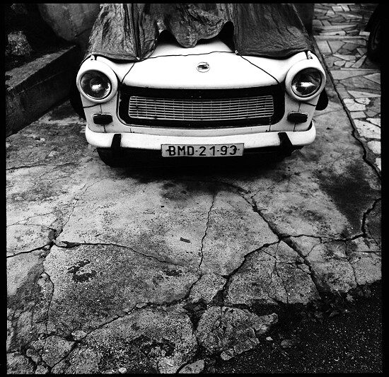 white car on broken street