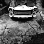 white car on broken street