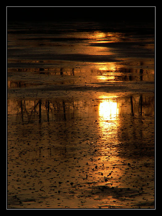 západ nad vypuštěným rybníkem