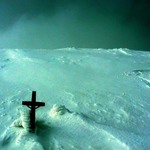 small cross on a big mountain